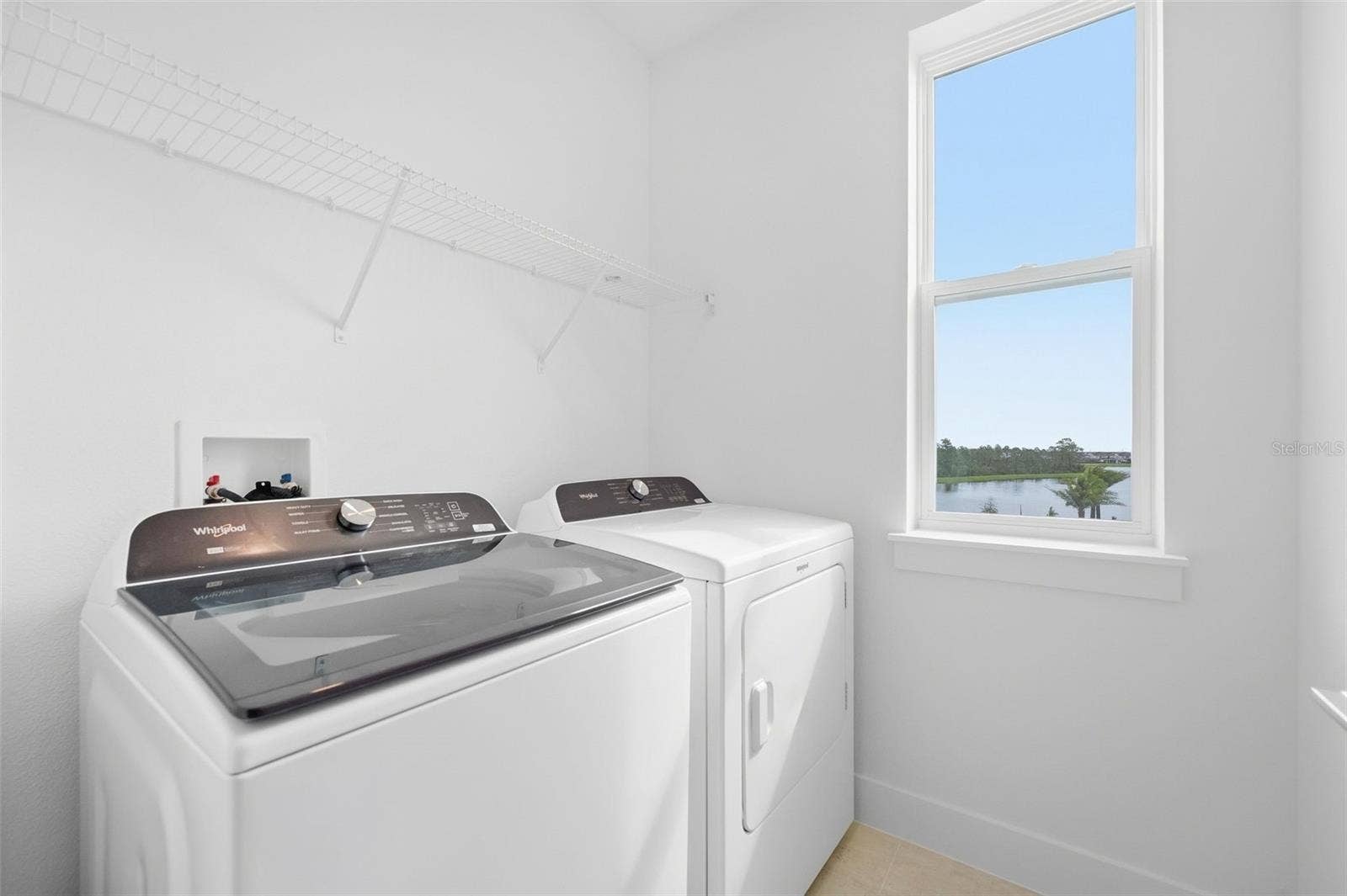 9317 LUMINARY BOULEVARD, Orlando, FL 32827 Laundry room with washer and dryer included
