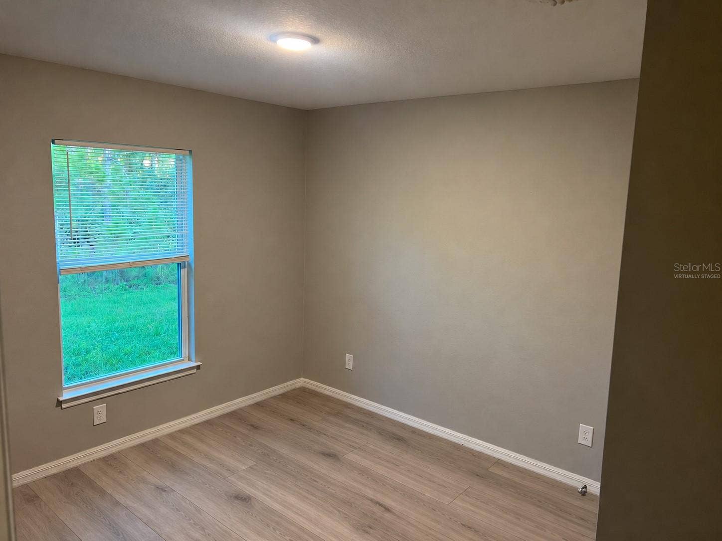 3404 61ST STREET W, Lehigh Acres, FL 33971 Bedroom 2 virtually staged: planned laminate flooring.