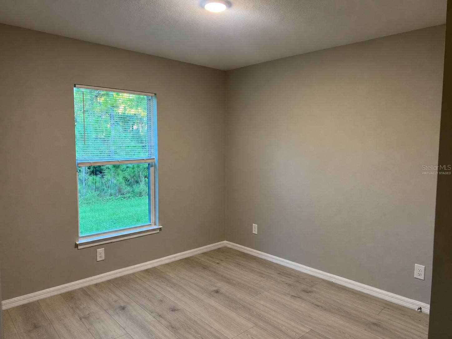 3404 61ST STREET W, Lehigh Acres, FL 33971 Bedroom 1 virtually staged: planned laminate flooring.