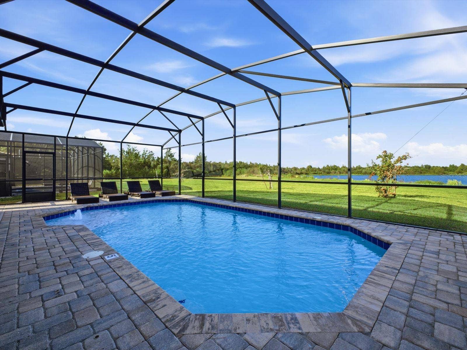 Screened in west facing pool with water view