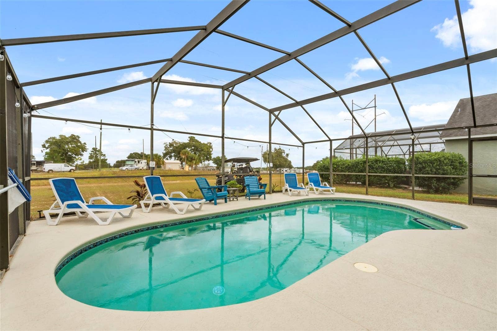 551 MAJESTY DRIVE, Davenport, FL 33837 Beautiful heated Pool freshly painted deck and no rear facing neighbors