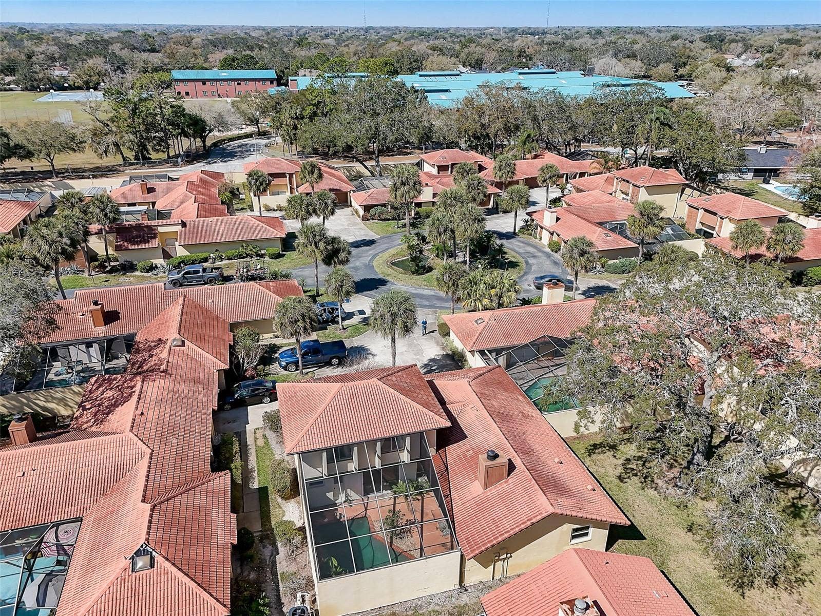 The Island Club HOA covers professionally maintained landscaping and grounds, roof maintenance, exterior painting, and access to the community clubhouse, fitness center, and Olympic-size community swimming pool. Community-wide exterior painting is planned for 2027.