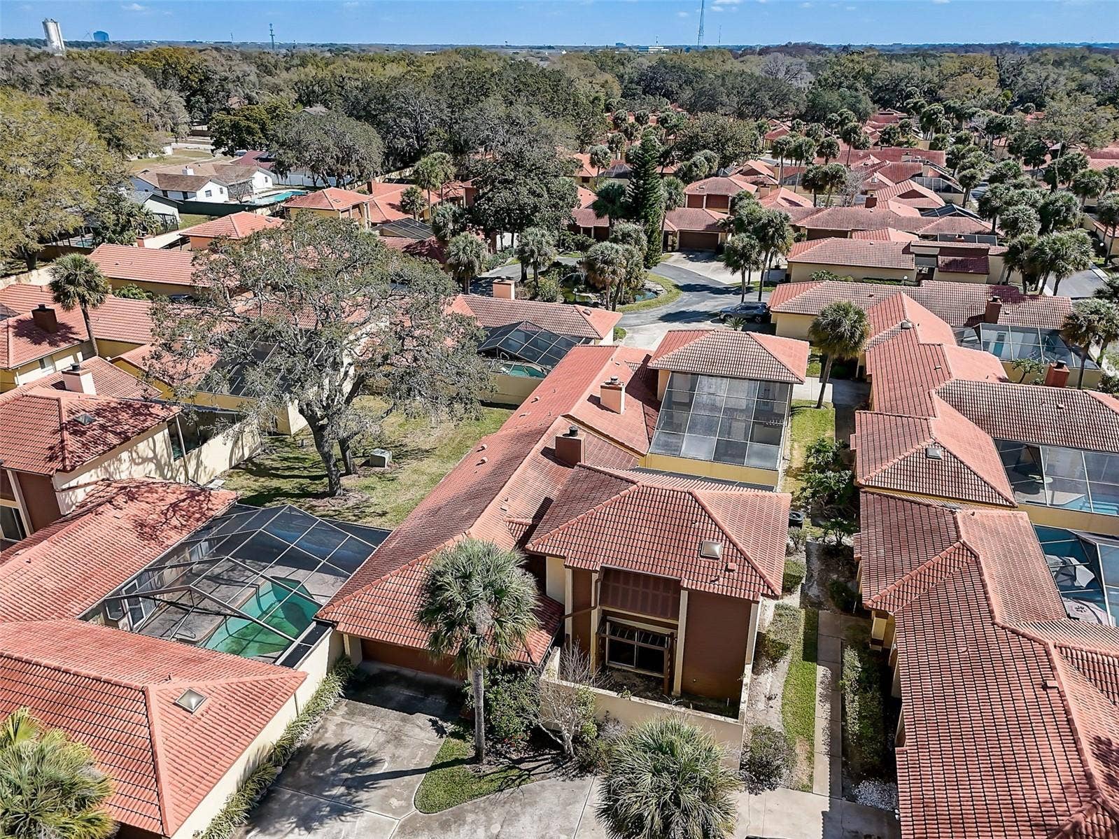 The Island Club HOA covers professionally maintained landscaping and grounds, roof maintenance, exterior painting, and access to the community clubhouse, fitness center, and Olympic-size community swimming pool. Community-wide exterior painting is planned for 2027.