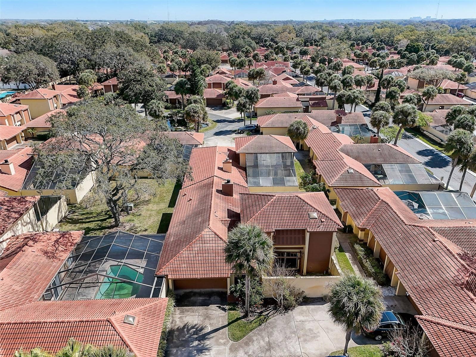 The Island Club HOA covers professionally maintained landscaping and grounds, roof maintenance, exterior painting, and access to the community clubhouse, fitness center, and Olympic-size community swimming pool. Community-wide exterior painting is planned for 2027.