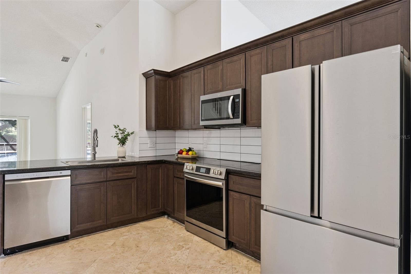 13714 HUNTWICK DRIVE, Orlando, FL 32837 Granite counters and stainless steel appliances