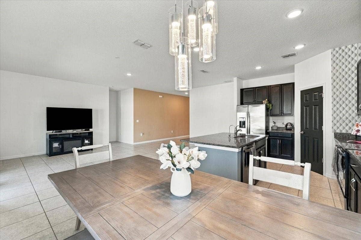 Open-concept kitchen and dining area with plenty of natural light and an inviting layout for everyday living and entertaining.