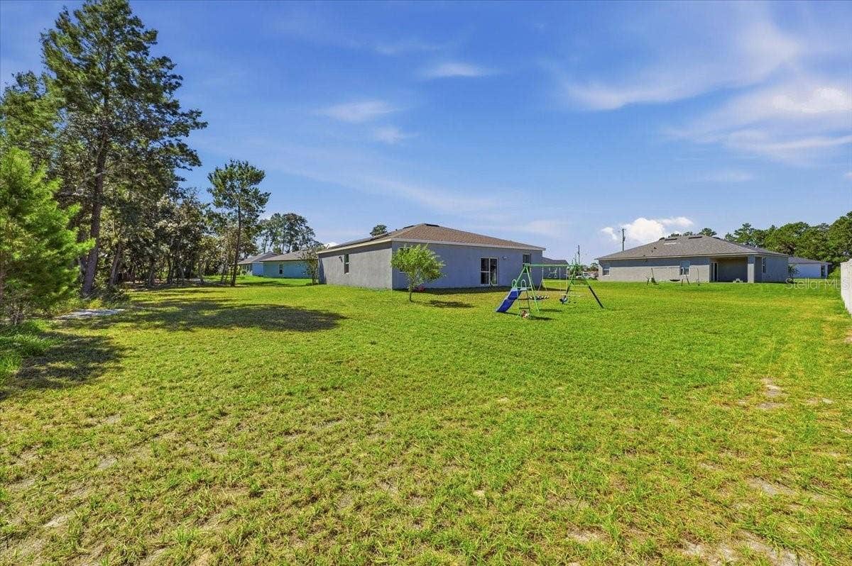 Enjoy a spacious backyard with plenty of open green space for outdoor activities, entertaining, and relaxation.