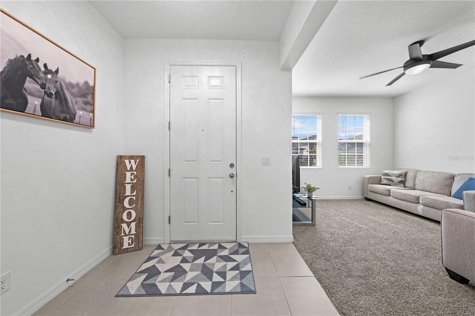 5657 CAMILLA STREET, St Cloud, FL 34771 Front door and living room