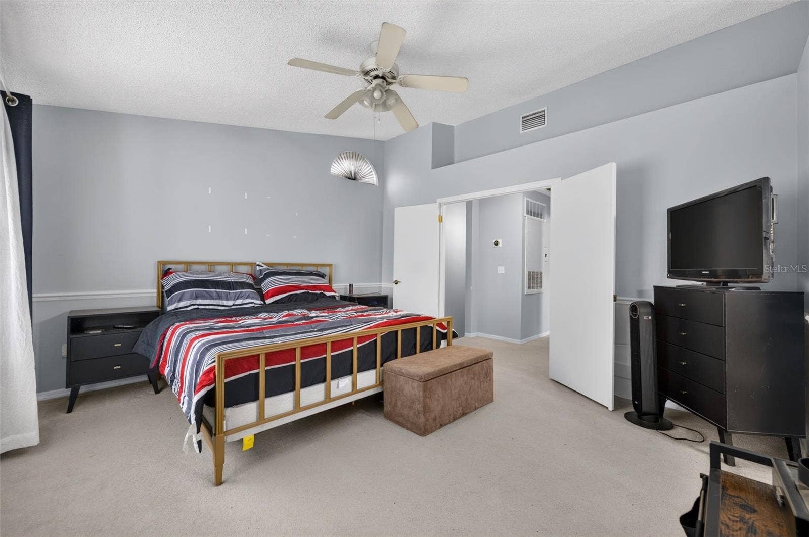 Spacious with double doors and a walk-in closet.