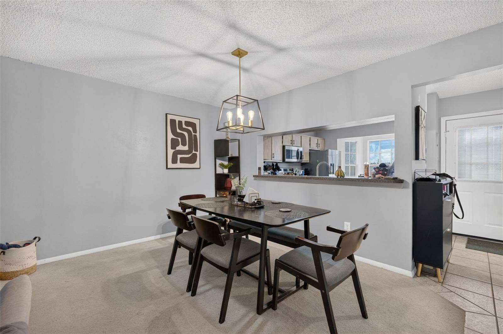 Dining space with opening to kitchen.