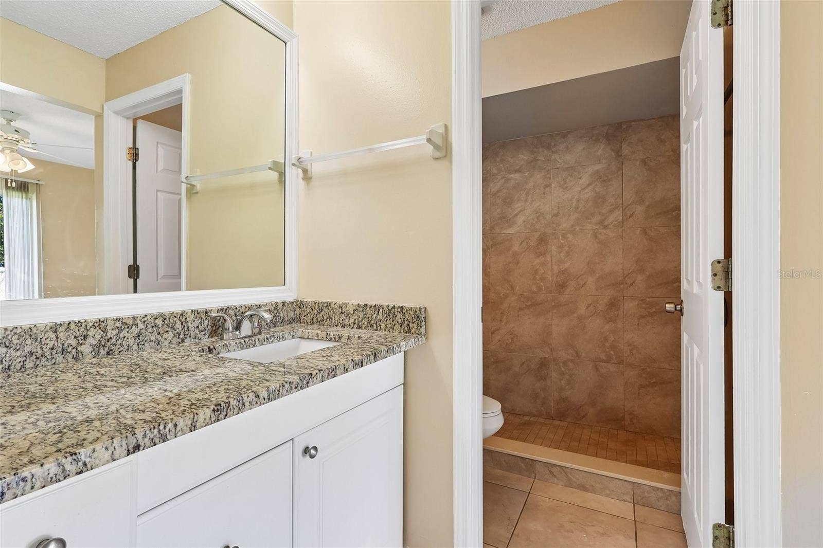 10031 PORTALE AVENUE, Orlando, FL 32825 Primary en-suite bath.