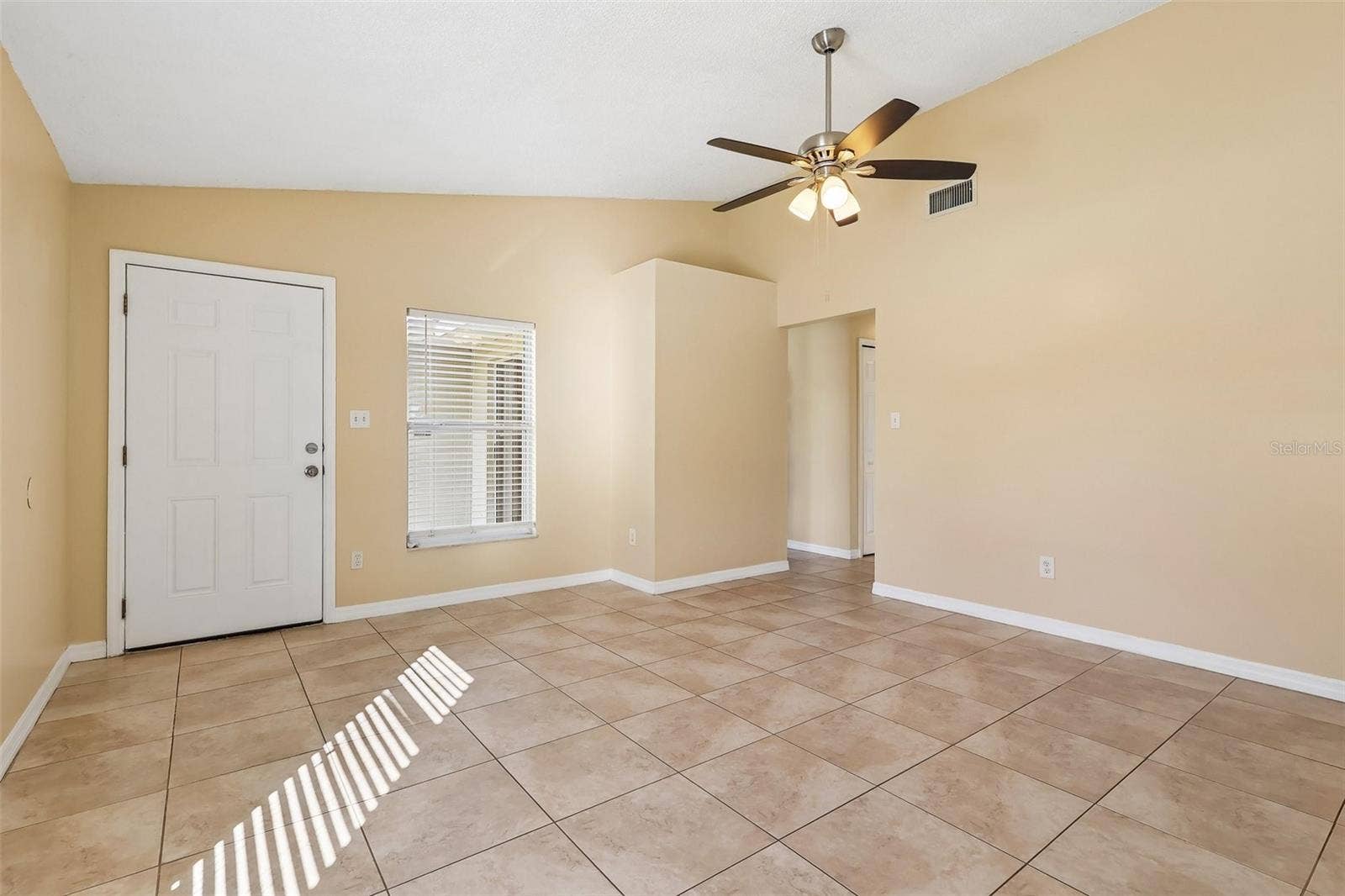 10031 PORTALE AVENUE, Orlando, FL 32825 Front entry, living room.
