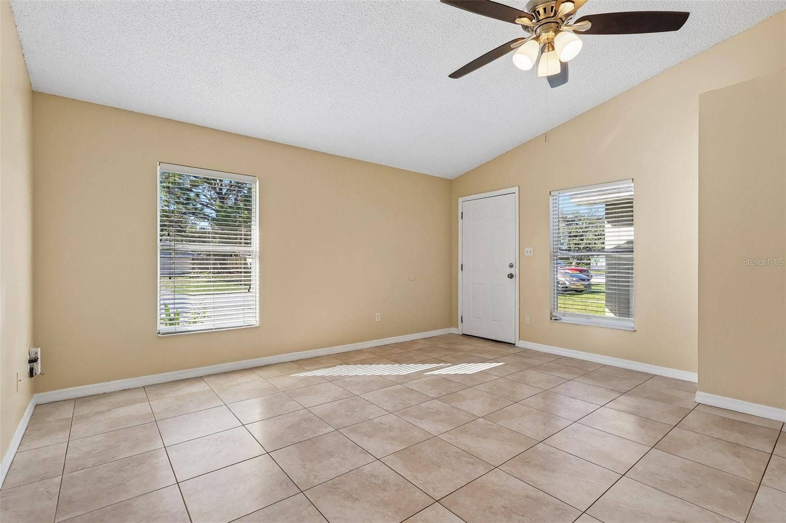 10031 PORTALE AVENUE, Orlando, FL 32825 Front entry, living room.