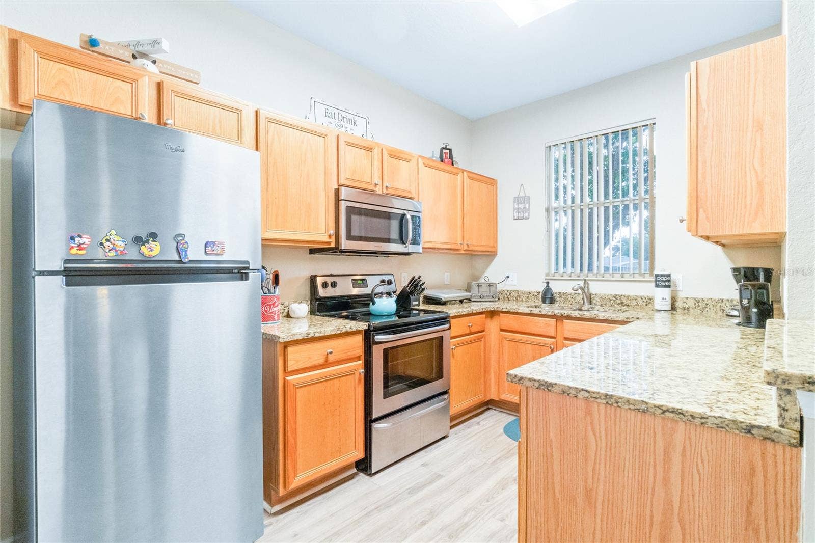 2010 CALABRIA AVENUE, Davenport, FL 33897 Kitchen with stainless steel appliances