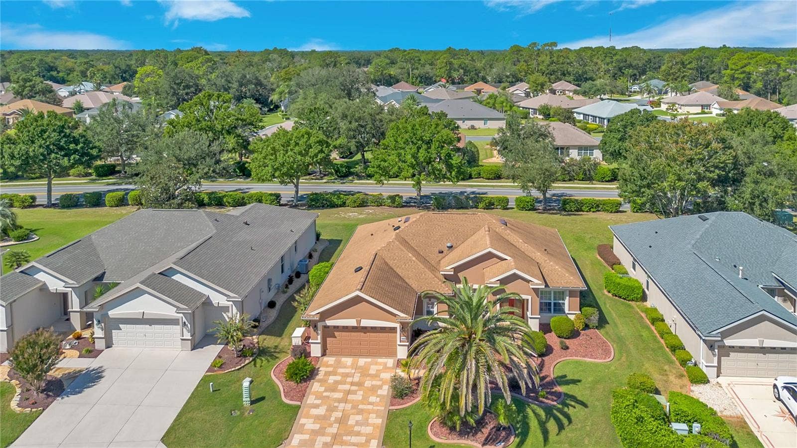 Discover this beautifully maintained home nestled within the established Spruce Creek Golf & Country Club community.