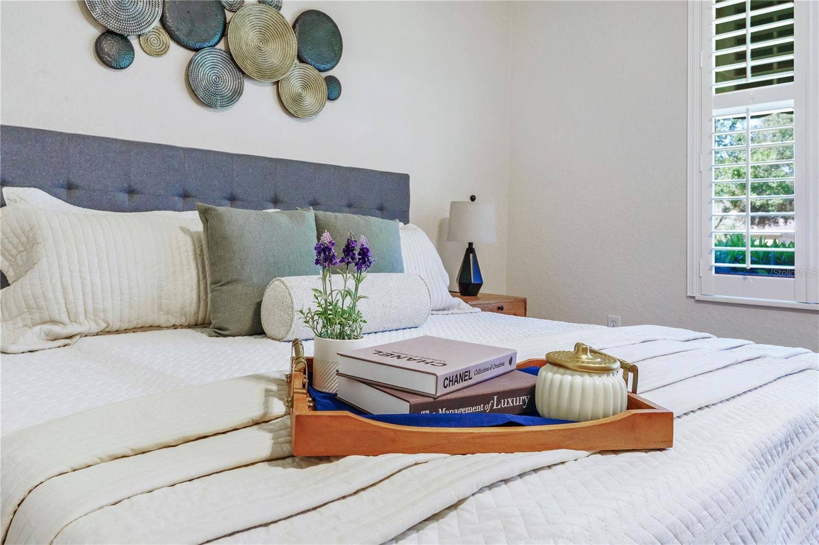 Relaxing primary bedroom retreat with attractive finishes and an inviting, airy feel.