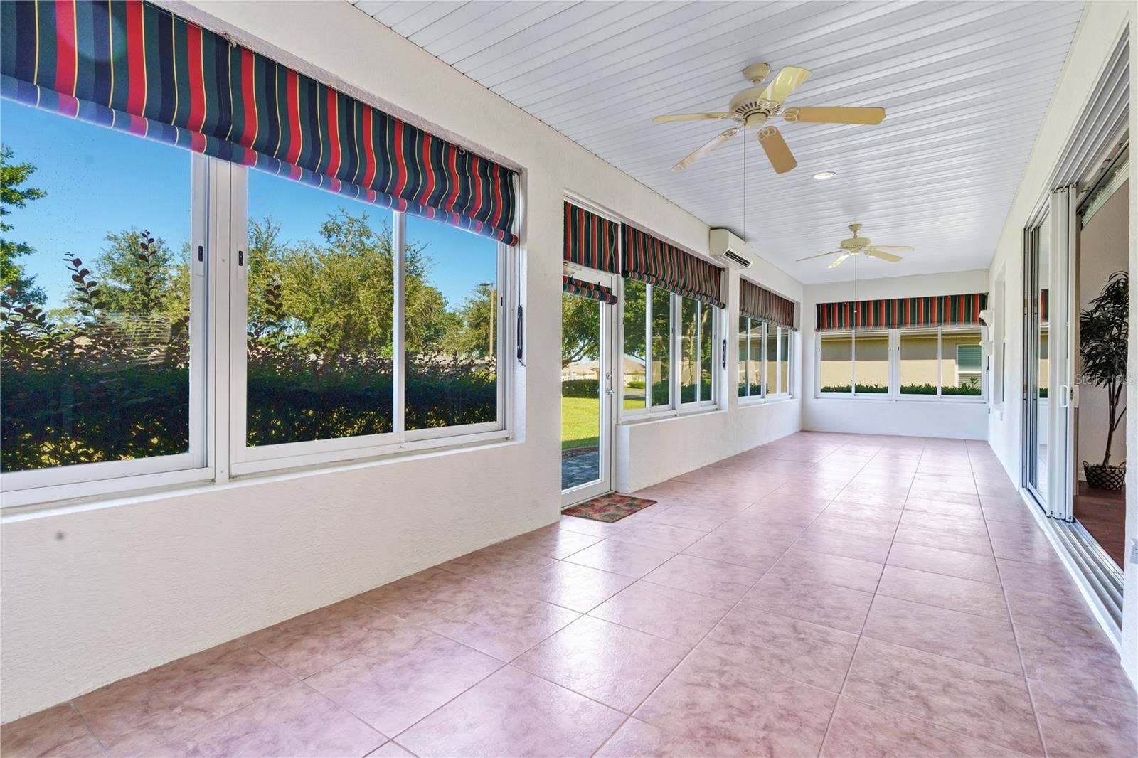 Impressive 40 x 10 enclosed lanai with dedicated split AC, offering approximately 400 square feet of flexible, climate-controlled space.