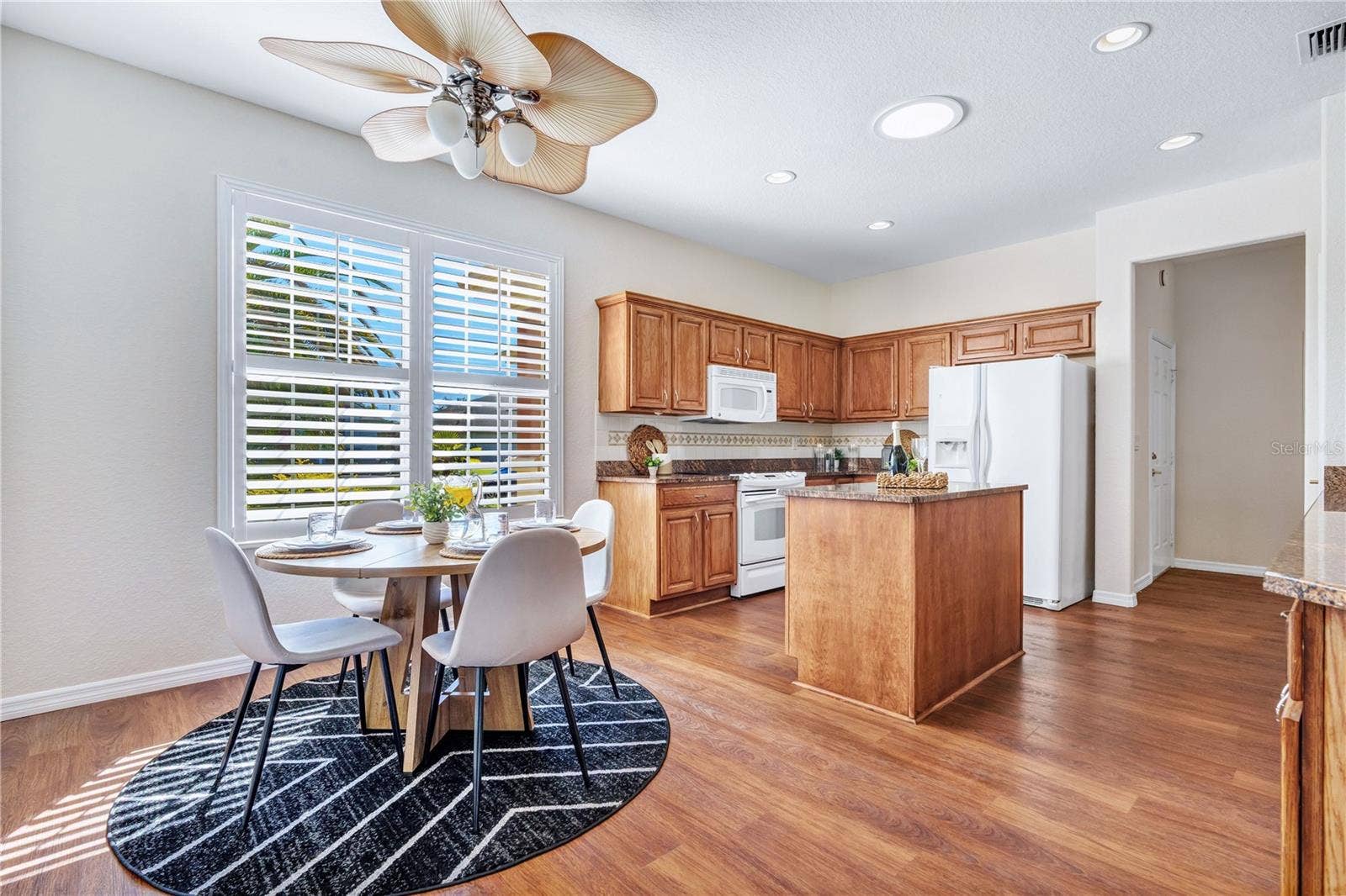 Sunlit breakfast nook overlooking the kitchen, perfect for morning coffee and casual dining.