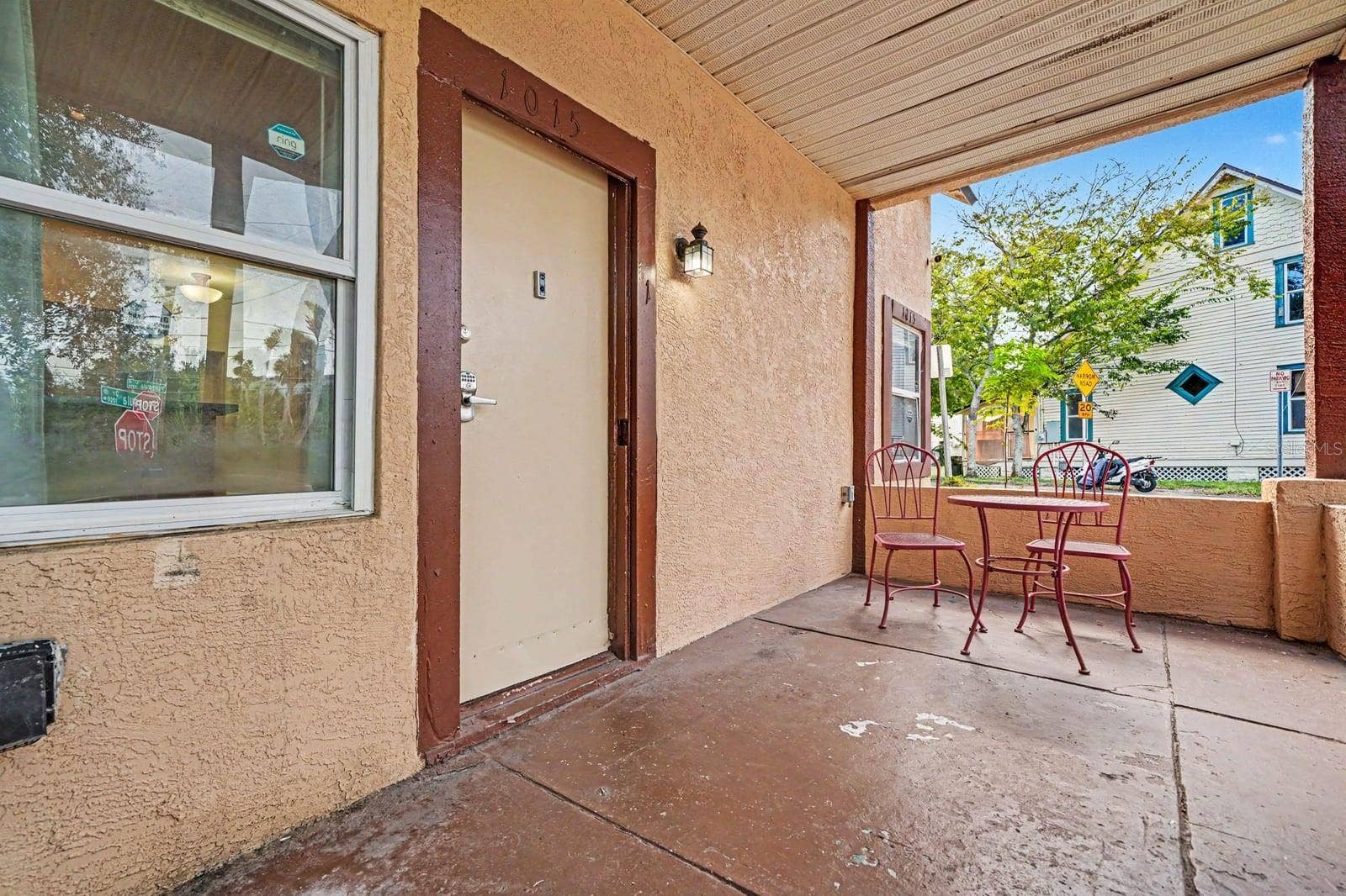1015 S PENINSULA DRIVE, #1,2, Daytona Beach, FL 32118 Front Porch Seating Area With Covered Overhang & Windows