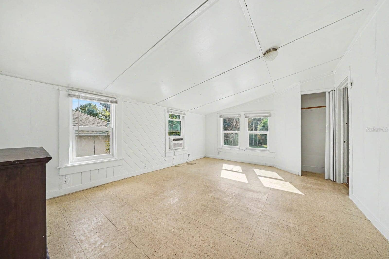 1015 S PENINSULA DRIVE, #1,2, Daytona Beach, FL 32118 Vaulted Ceiling Living Space with Multiple Windows & Natural Light