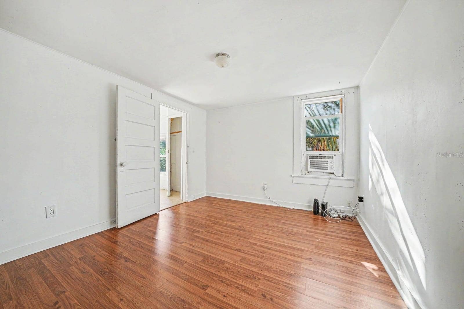 1015 S PENINSULA DRIVE, #1,2, Daytona Beach, FL 32118 Spacious Bedroom with Hardwood Floors, Large Closet & Bright Window