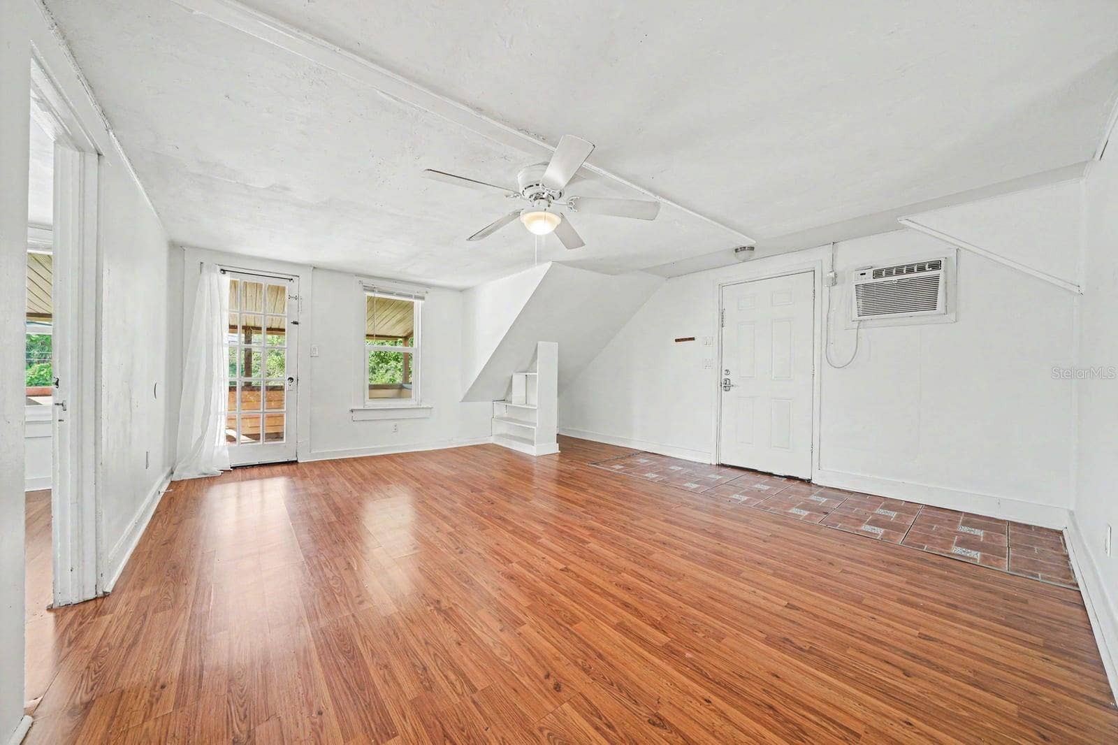 1015 S PENINSULA DRIVE, #1,2, Daytona Beach, FL 32118 Upper Level Living Space with Wood Floors, Glass Doors & Natural Light