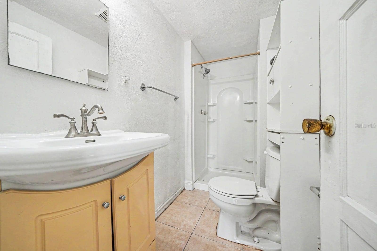1015 S PENINSULA DRIVE, #1,2, Daytona Beach, FL 32118 Guest Bath with Yellow Vanity, Shower Enclosure & Ceramic Tile