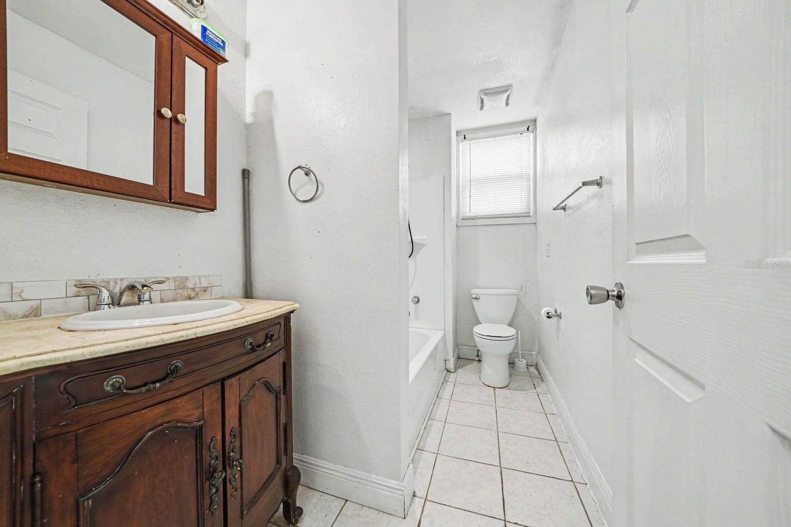 1015 S PENINSULA DRIVE, #1,2, Daytona Beach, FL 32118 Master Bath with Wood Vanity, Separate Tub & Shower, Tile Flooring