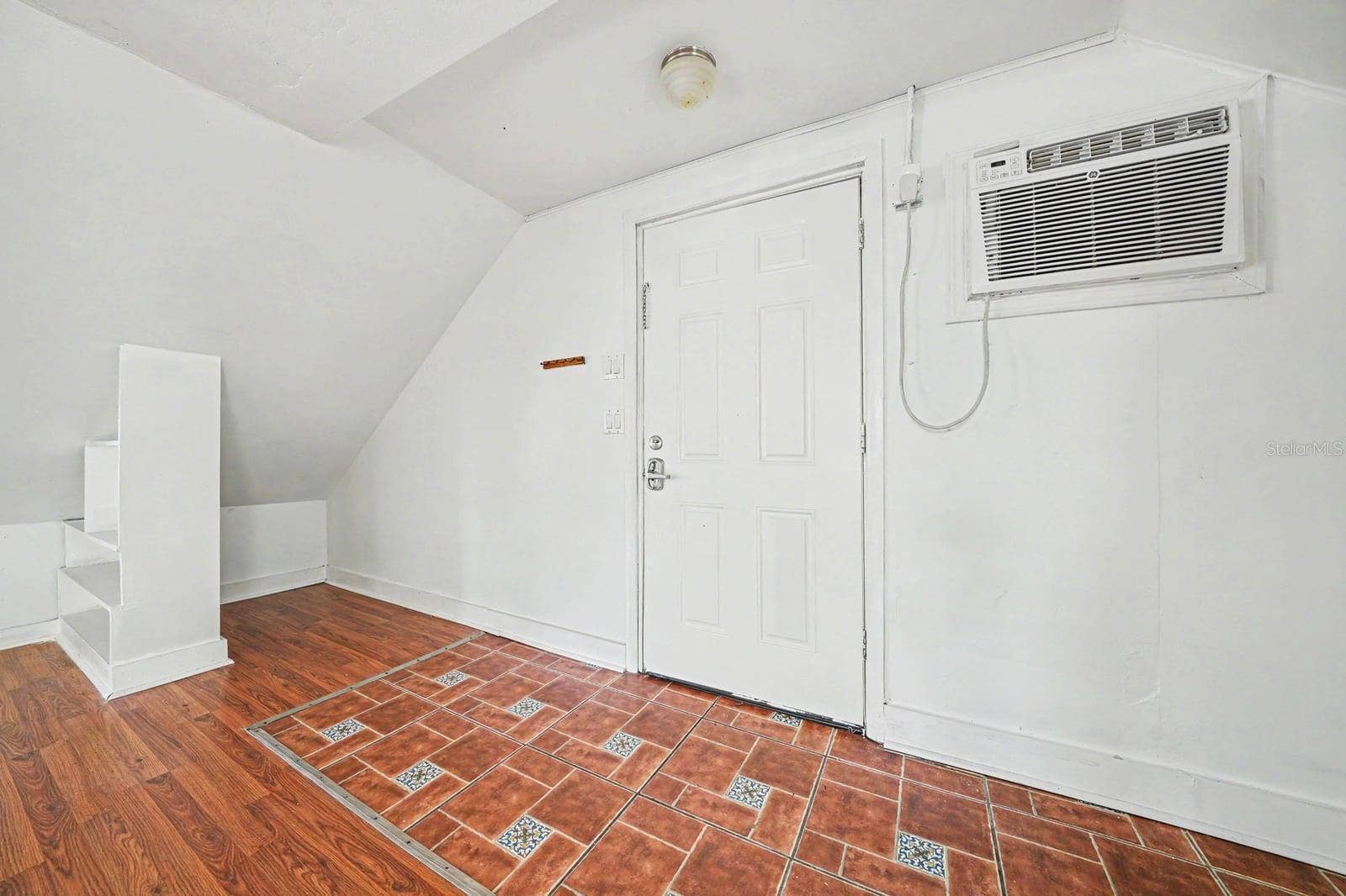 1015 S PENINSULA DRIVE, #1,2, Daytona Beach, FL 32118 Upper Level Room with A/C Unit, Decorative Tile, Attic Access