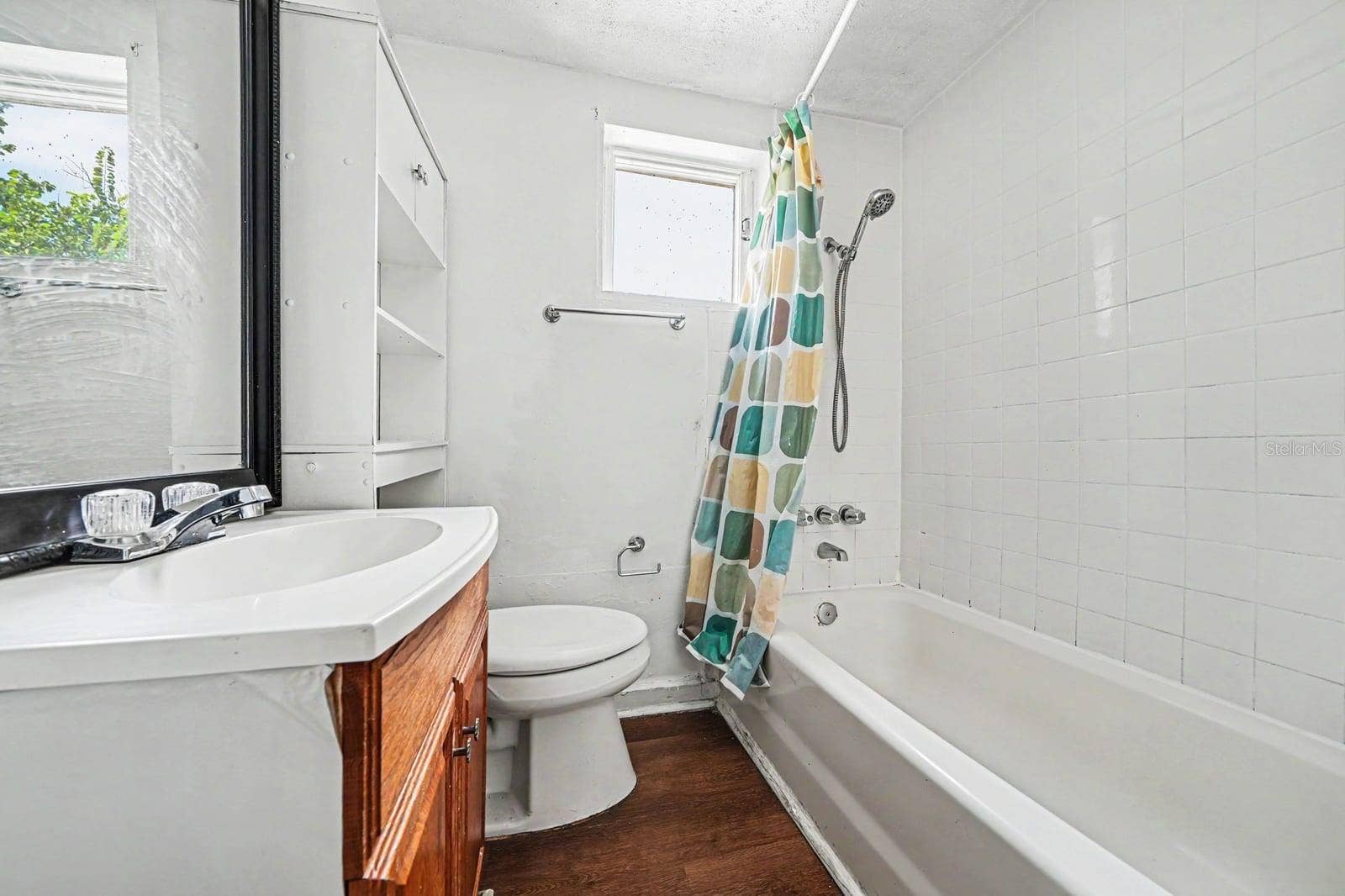 1015 S PENINSULA DRIVE, #1,2, Daytona Beach, FL 32118 Full Bathroom with Vanity, Toilet, Tub & Shower with Window