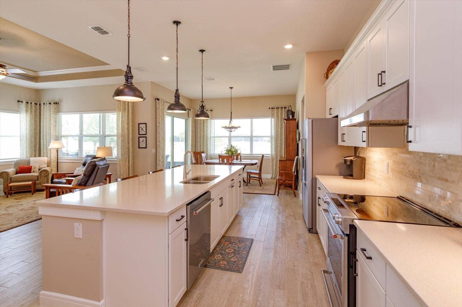 5663 SW 92ND AVENUE ROAD, Ocala, FL 34481 Open Kitchen, Living and Dining Areas with Golf Course Views