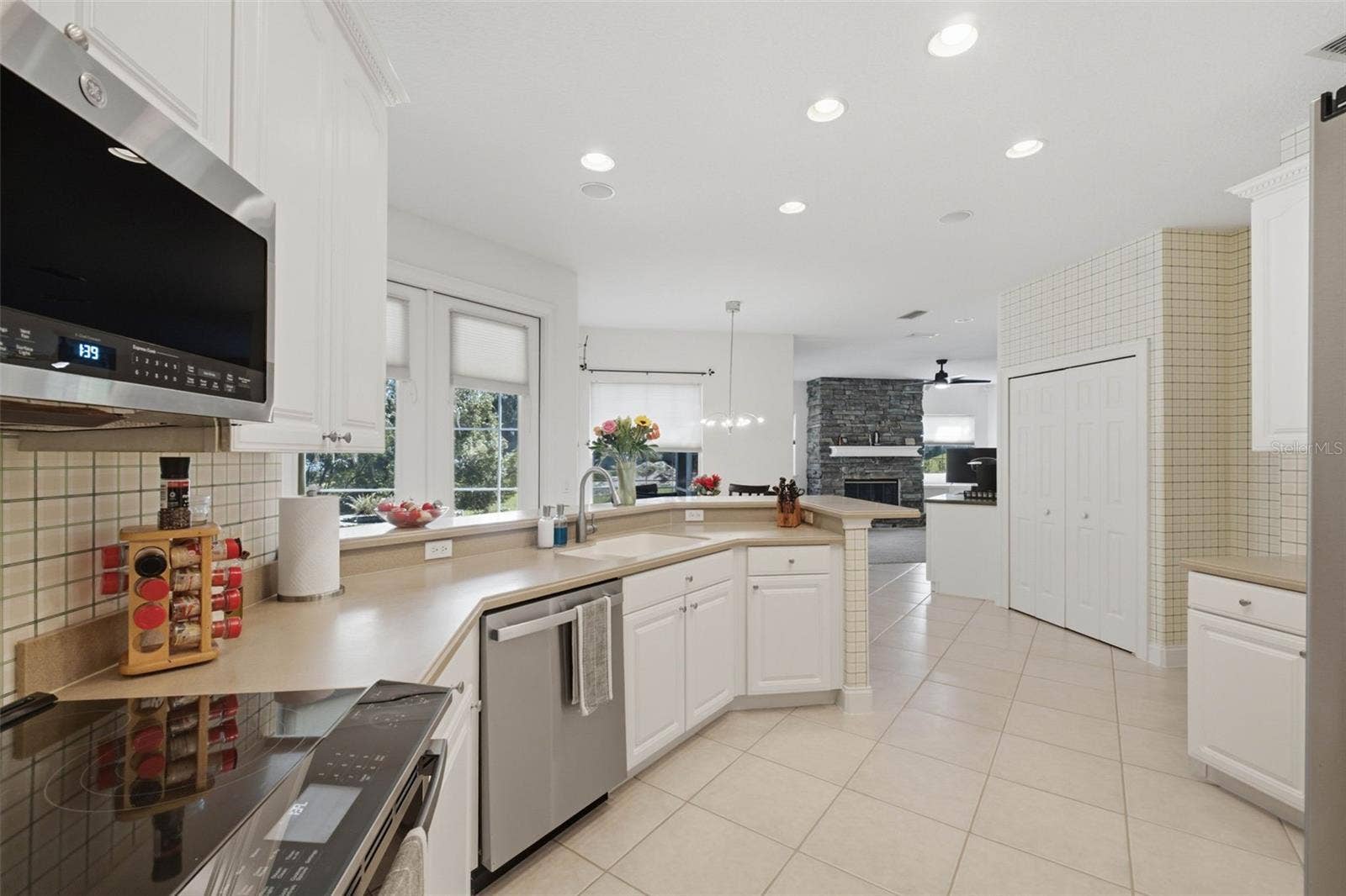 11025 LAKE KATHERINE CIRCLE, Clermont, FL 34711 Looking through kitchen to family room
