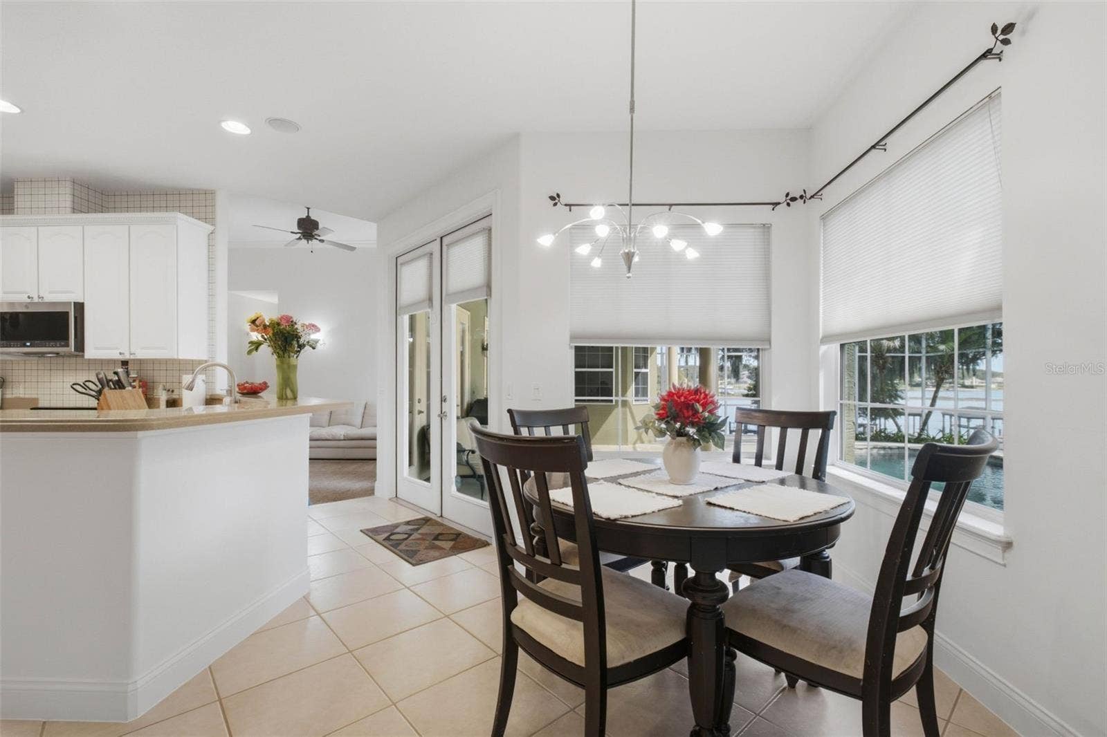 11025 LAKE KATHERINE CIRCLE, Clermont, FL 34711 Dining in kitchen with lake and pool view