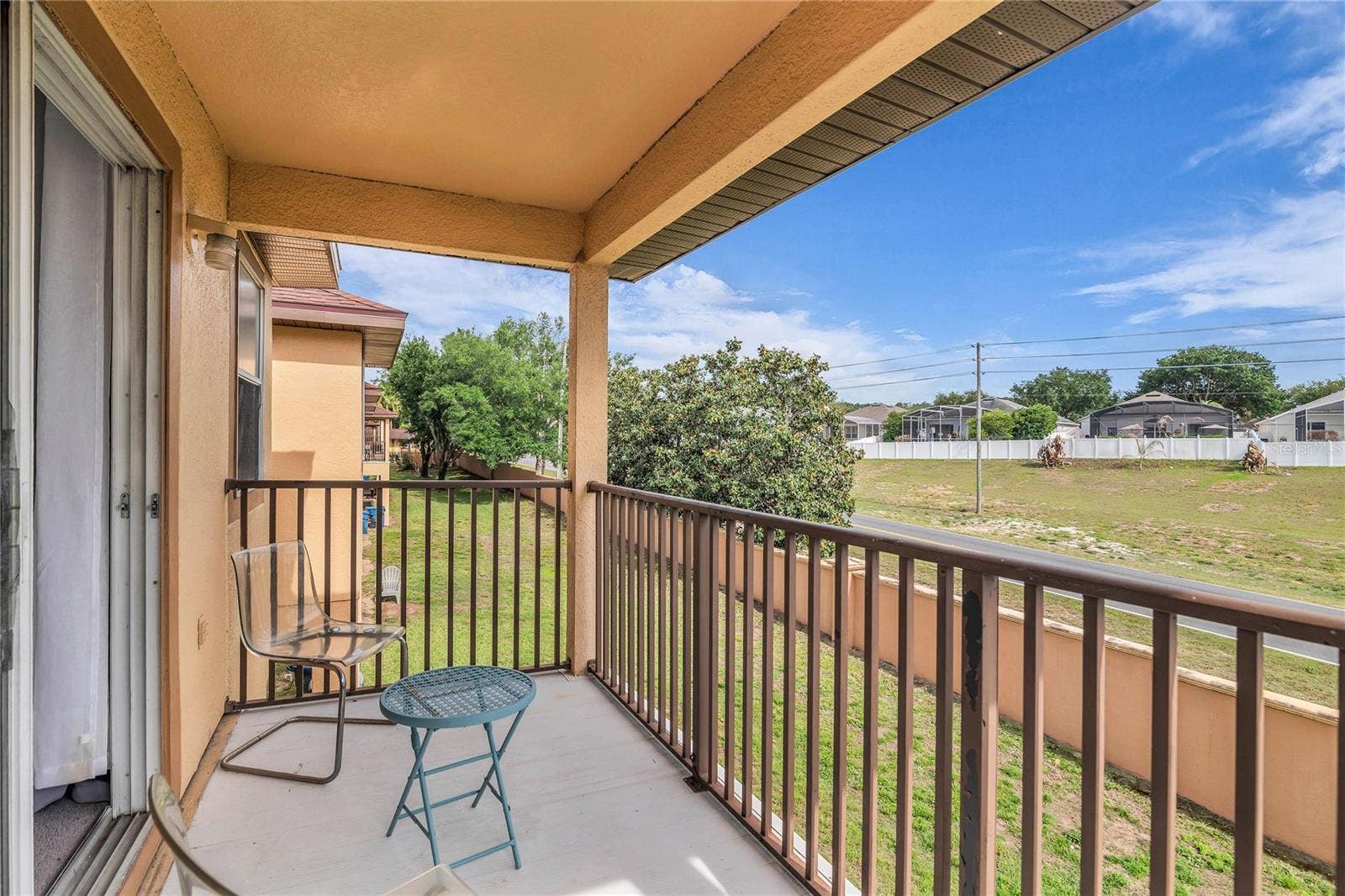 457 LA MIRAGE STREET, Davenport, FL 33897 Upstairs balcony from primary bedroom