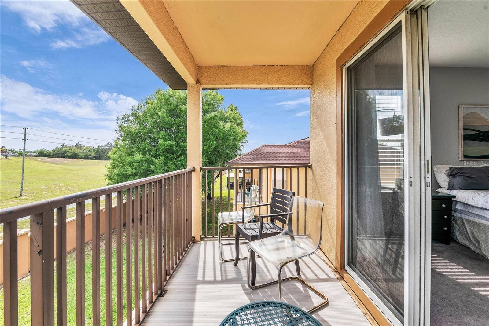 457 LA MIRAGE STREET, Davenport, FL 33897 Upstairs balcony from primary bedroom