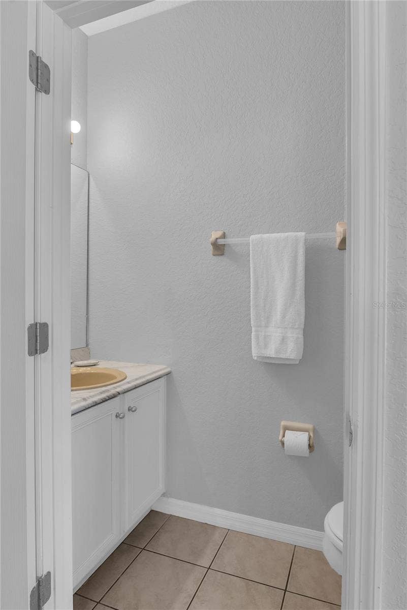 457 LA MIRAGE STREET, Davenport, FL 33897 Down stairs half bath