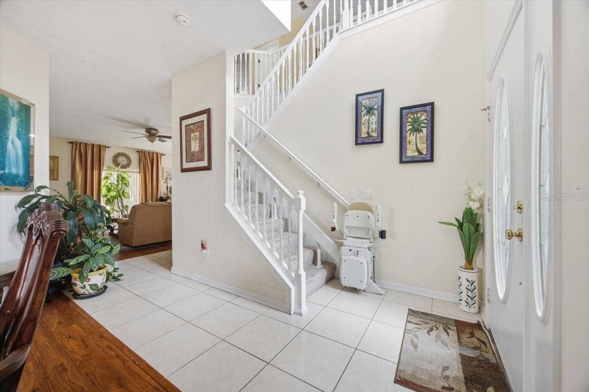 13728 HIDDEN FOREST CIRCLE, Orlando, FL 32828 Stairway with Automated Stair Chair