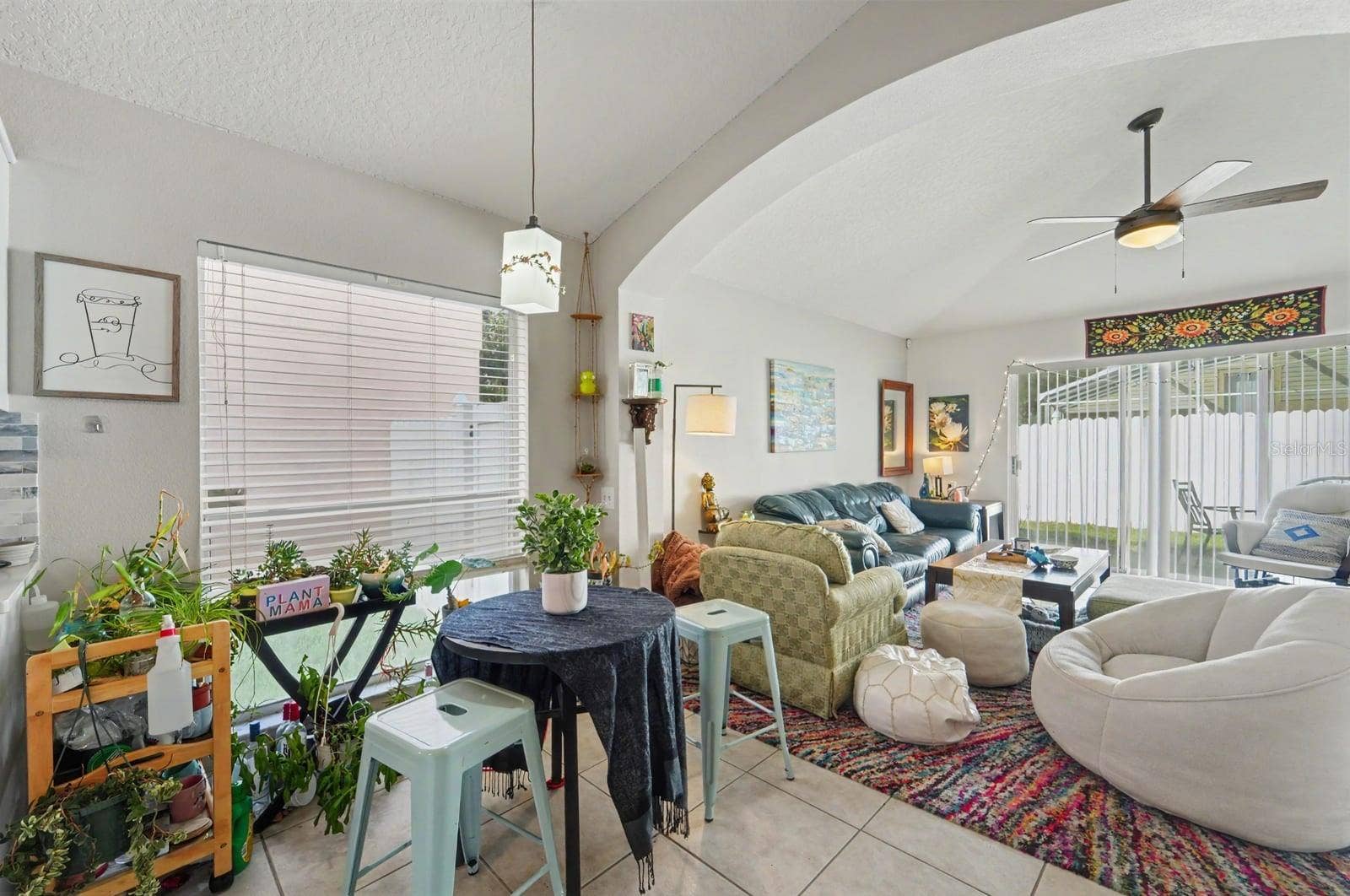 10913 BUCKWATER COURT, Orlando, FL 32817 Bright great room with cathedral ceiling, abundant natural light, and multiple seating zones