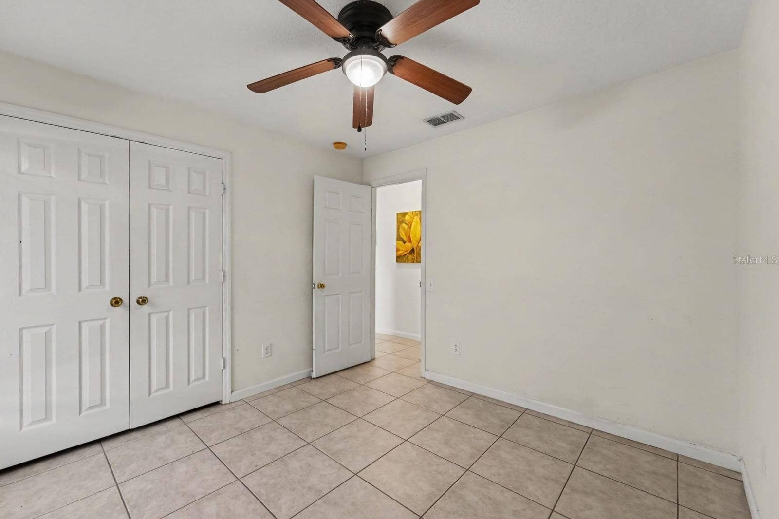 10913 BUCKWATER COURT, Orlando, FL 32817 Secondary Bedroom with Double Closets, Tile Floor & Ceiling Fan with Light
