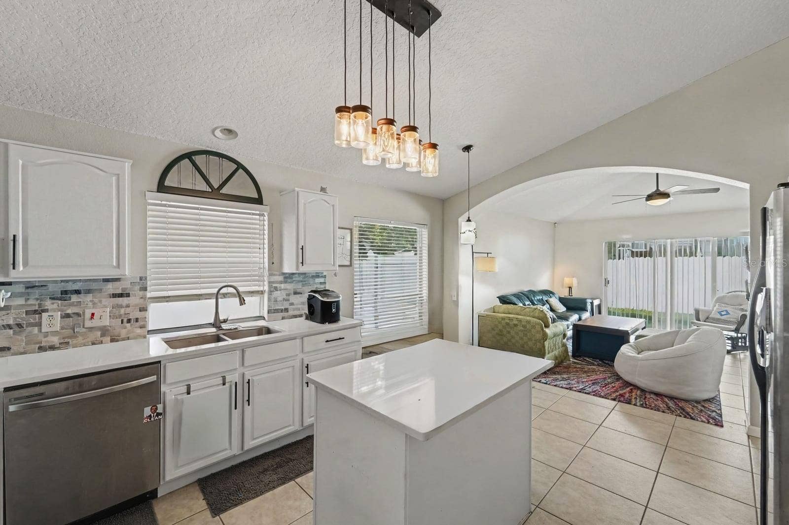 10913 BUCKWATER COURT, Orlando, FL 32817 Kitchen island and open floor plan perfect for entertaining and everyday living