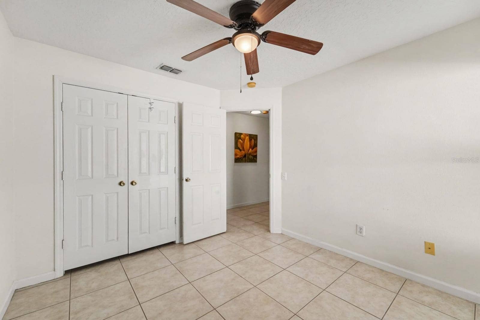 10913 BUCKWATER COURT, Orlando, FL 32817 Bright Bedroom with Large Window Overlooking Yard & Ceiling Fan with Light