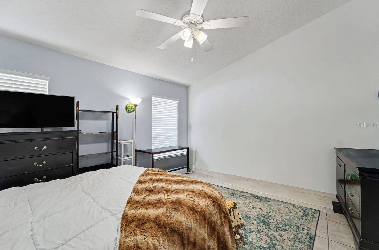10913 BUCKWATER COURT, Orlando, FL 32817 Master Bedroom Suite with Ensuite Access, Generous Closet Space, and Bright Natural Light
