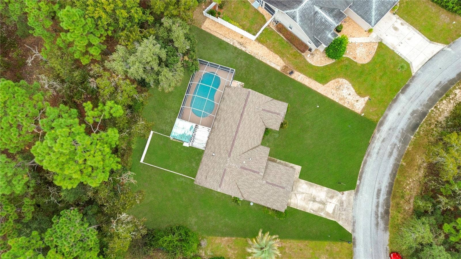 11 CARNATION COURT E, Homosassa, FL 34446 Wooded backdrop and no rear neighbors add privacy.