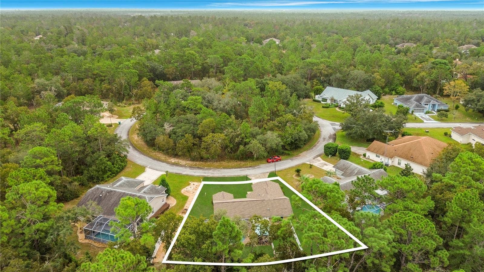 11 CARNATION COURT E, Homosassa, FL 34446 A wooded setting. Lot lines shown are approximate.