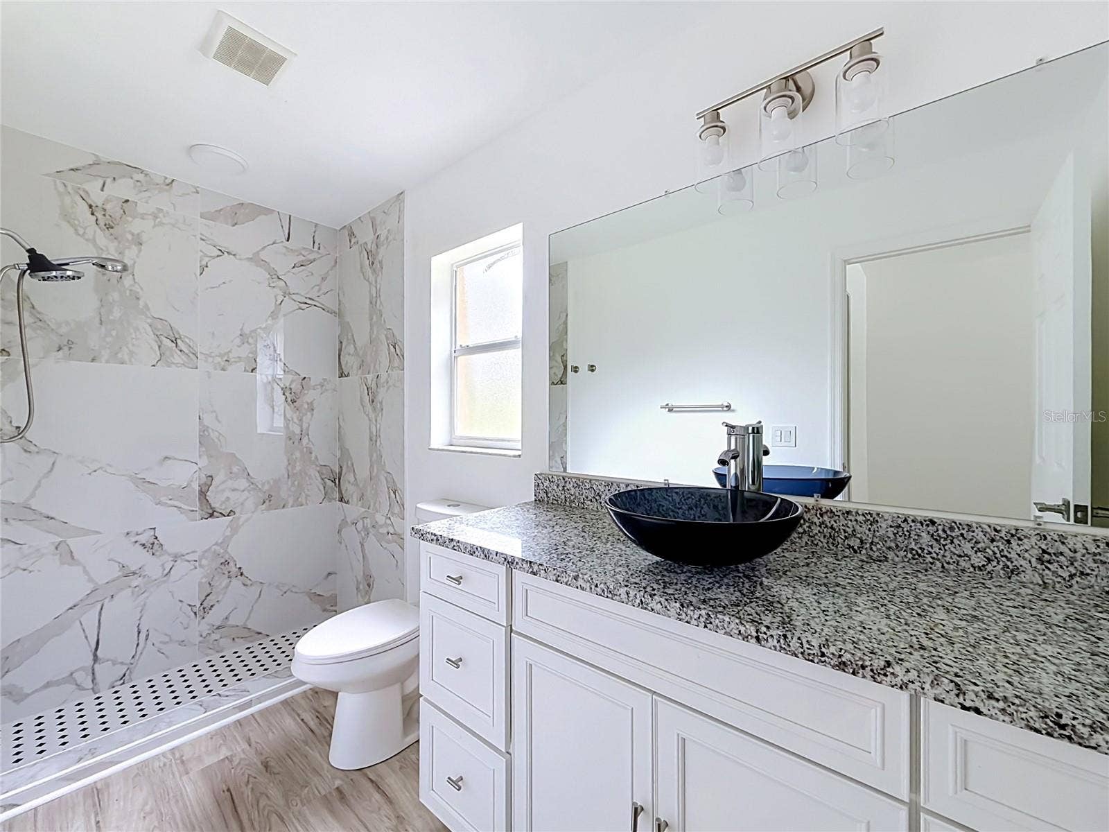 11 CARNATION COURT E, Homosassa, FL 34446 A tiled walk-in shower adds style to your daily routine.
