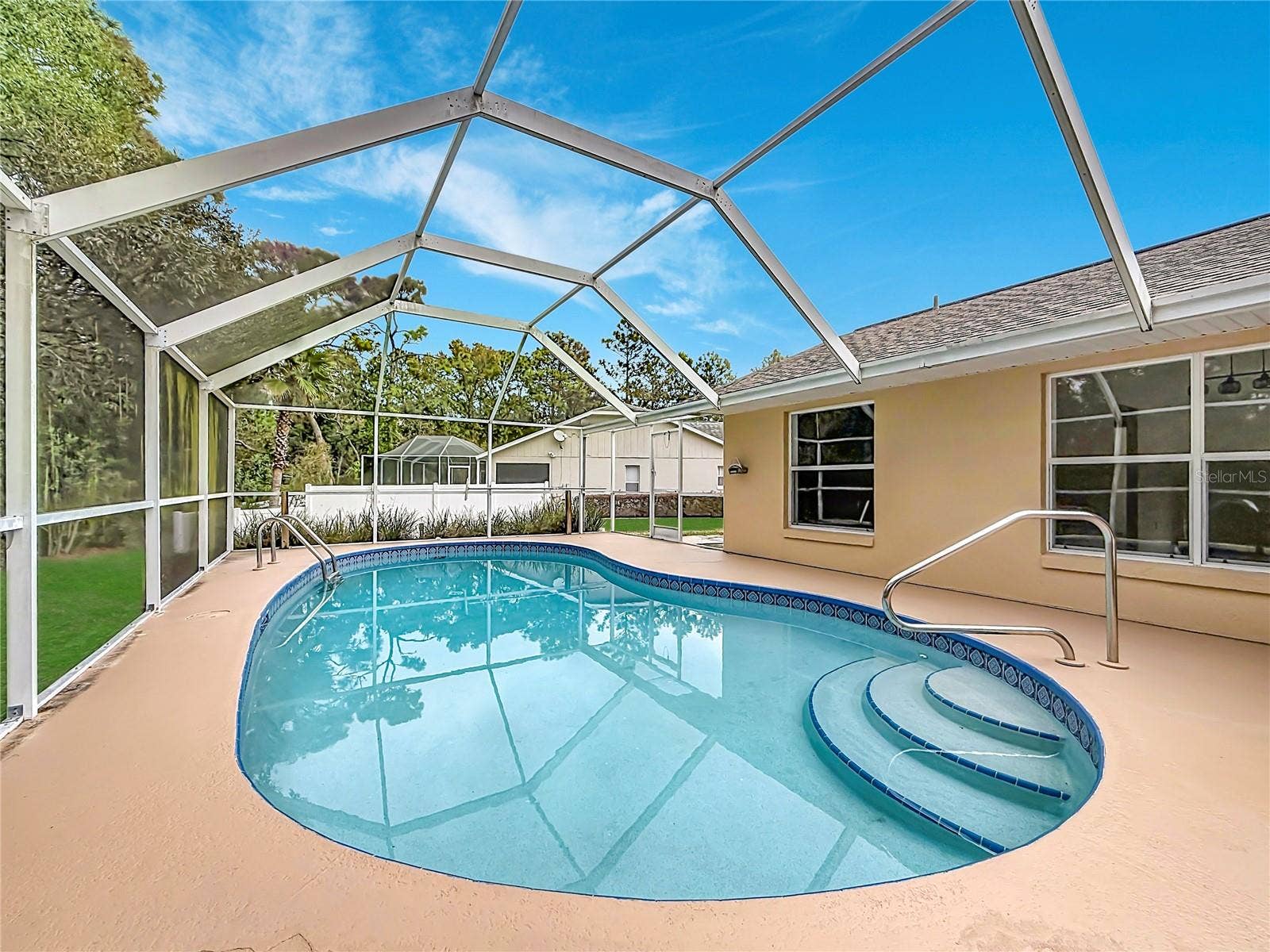 11 CARNATION COURT E, Homosassa, FL 34446 Take a refreshing dip in your screened backyard pool.