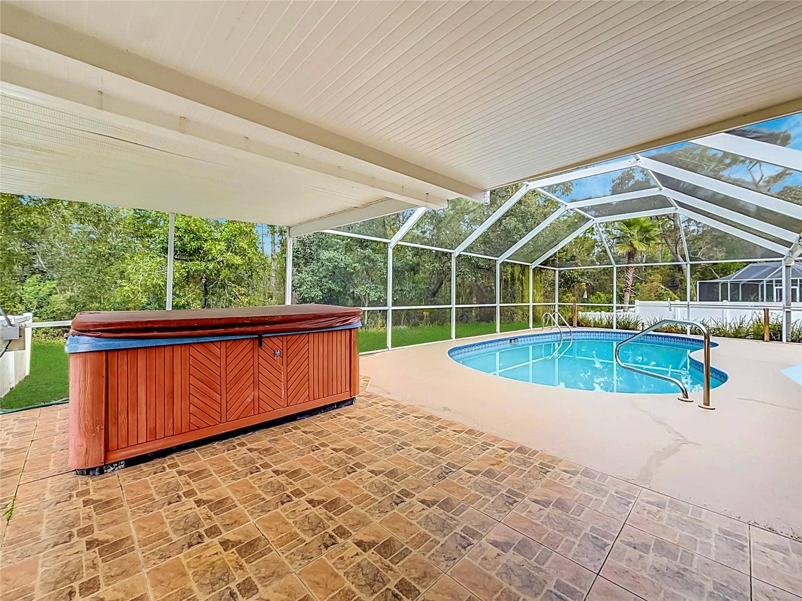 11 CARNATION COURT E, Homosassa, FL 34446 Your shaded retreat beside a private screened pool