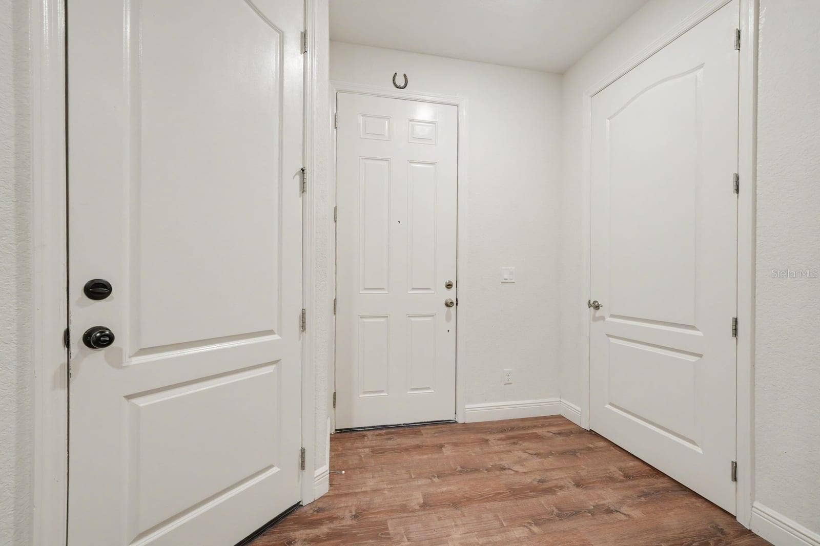 Foyer Entry With Closet Storage & Direct Access to Living Spaces