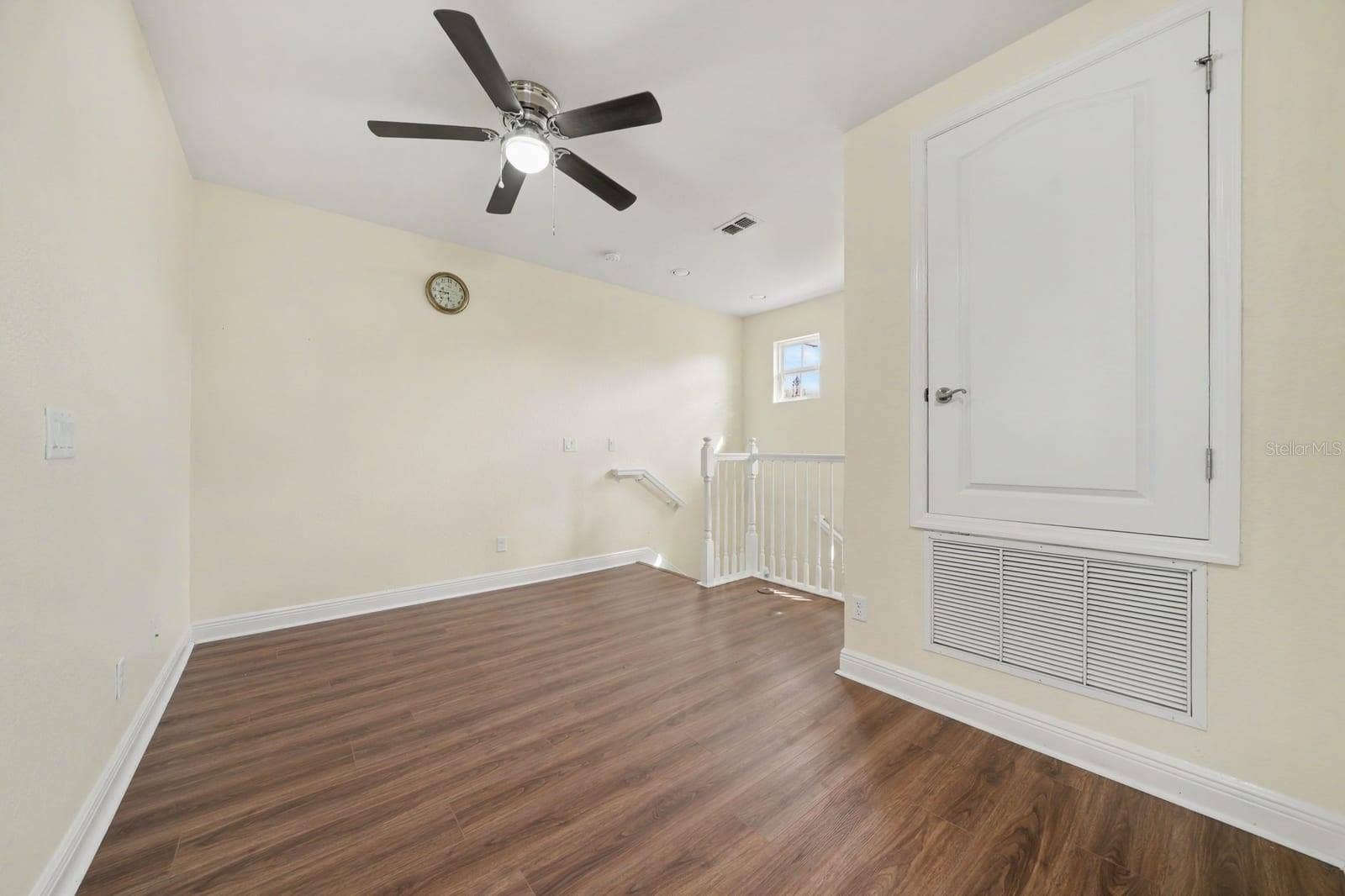 Bedroom with Vaulted Ceiling and Built-In Storage Shelves