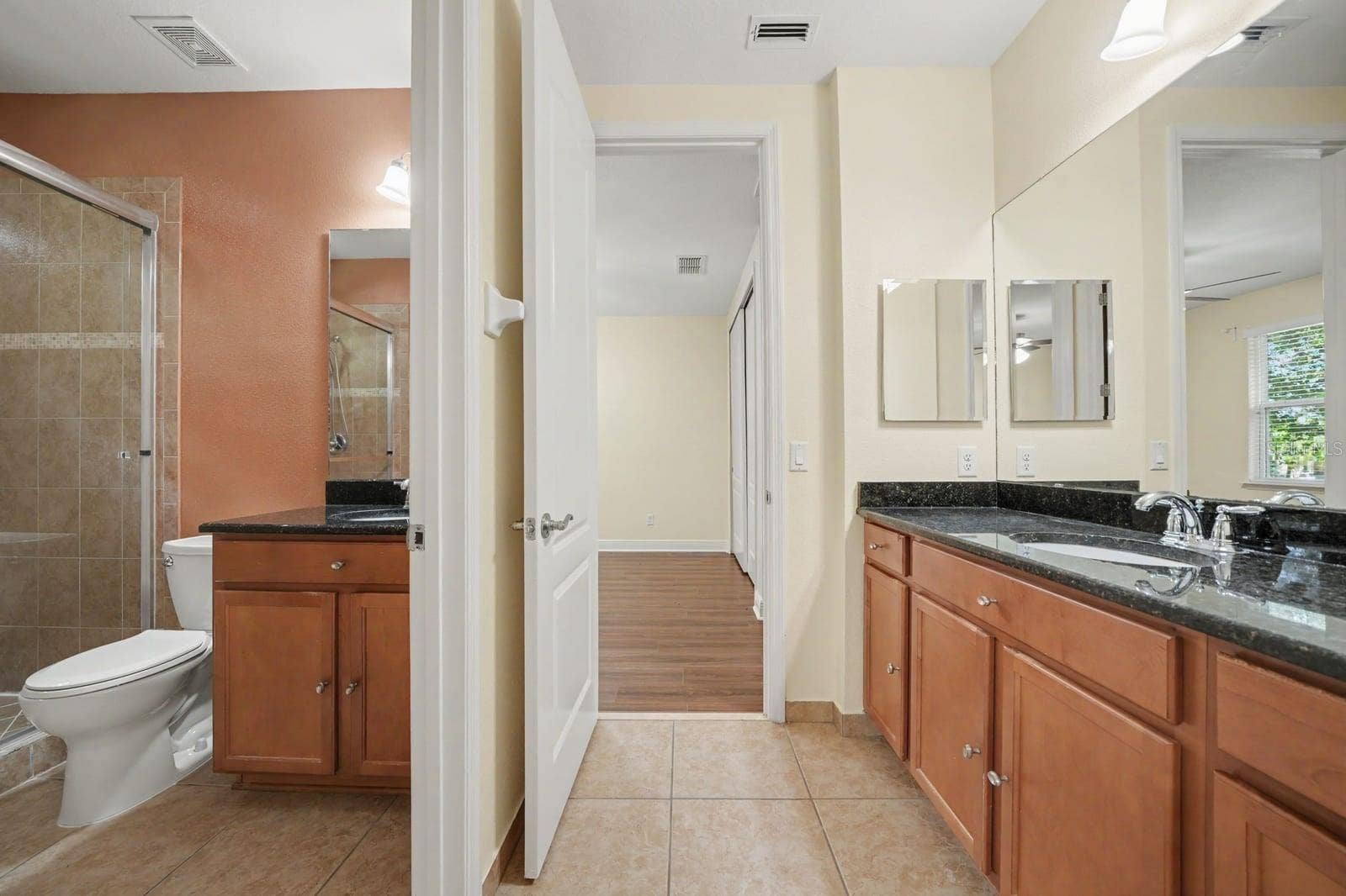 Master Bath with Dual Vanities, Black Granite Counters & Walk-In Shower